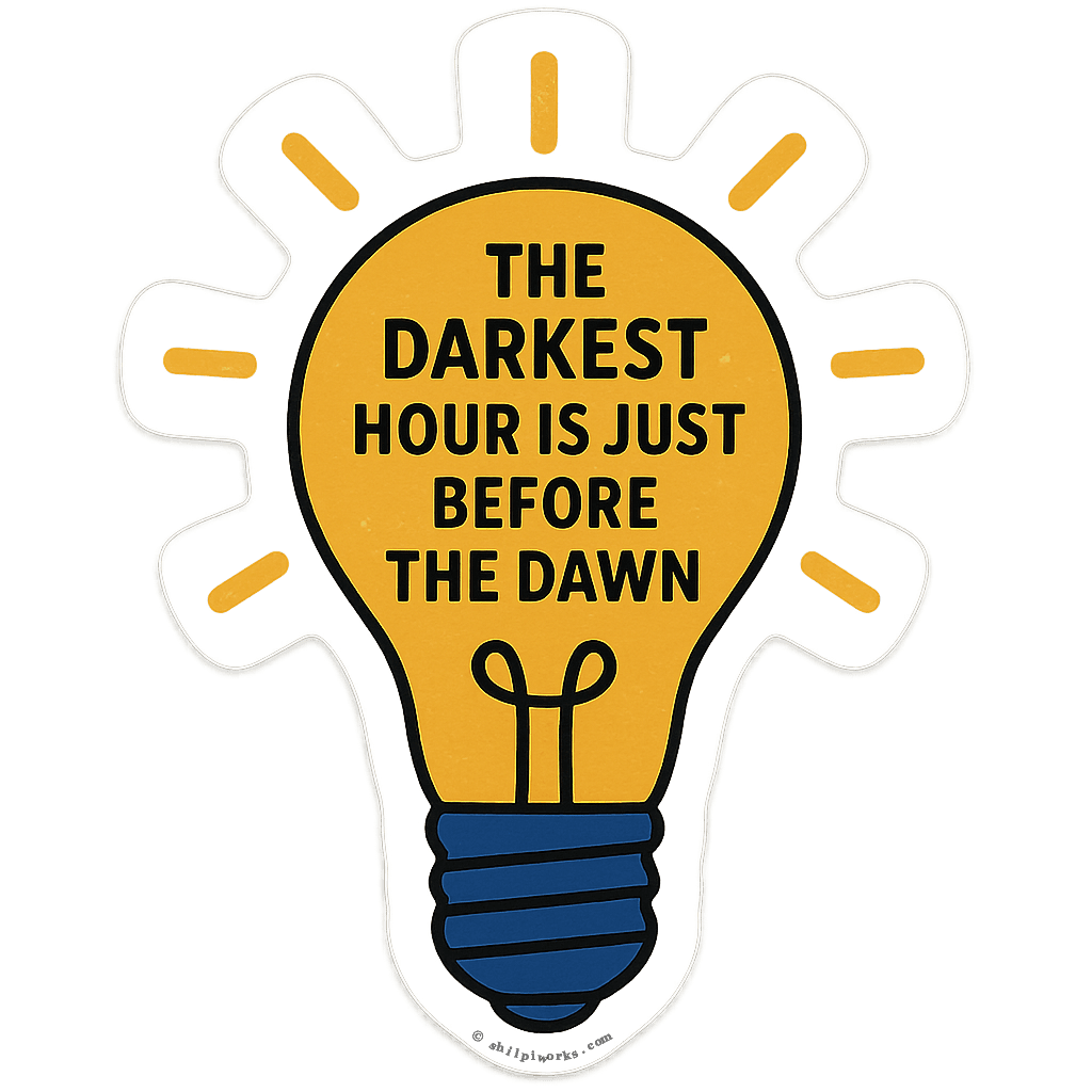 A lightbulb with the text 'The darkest hour is just before the dawn'