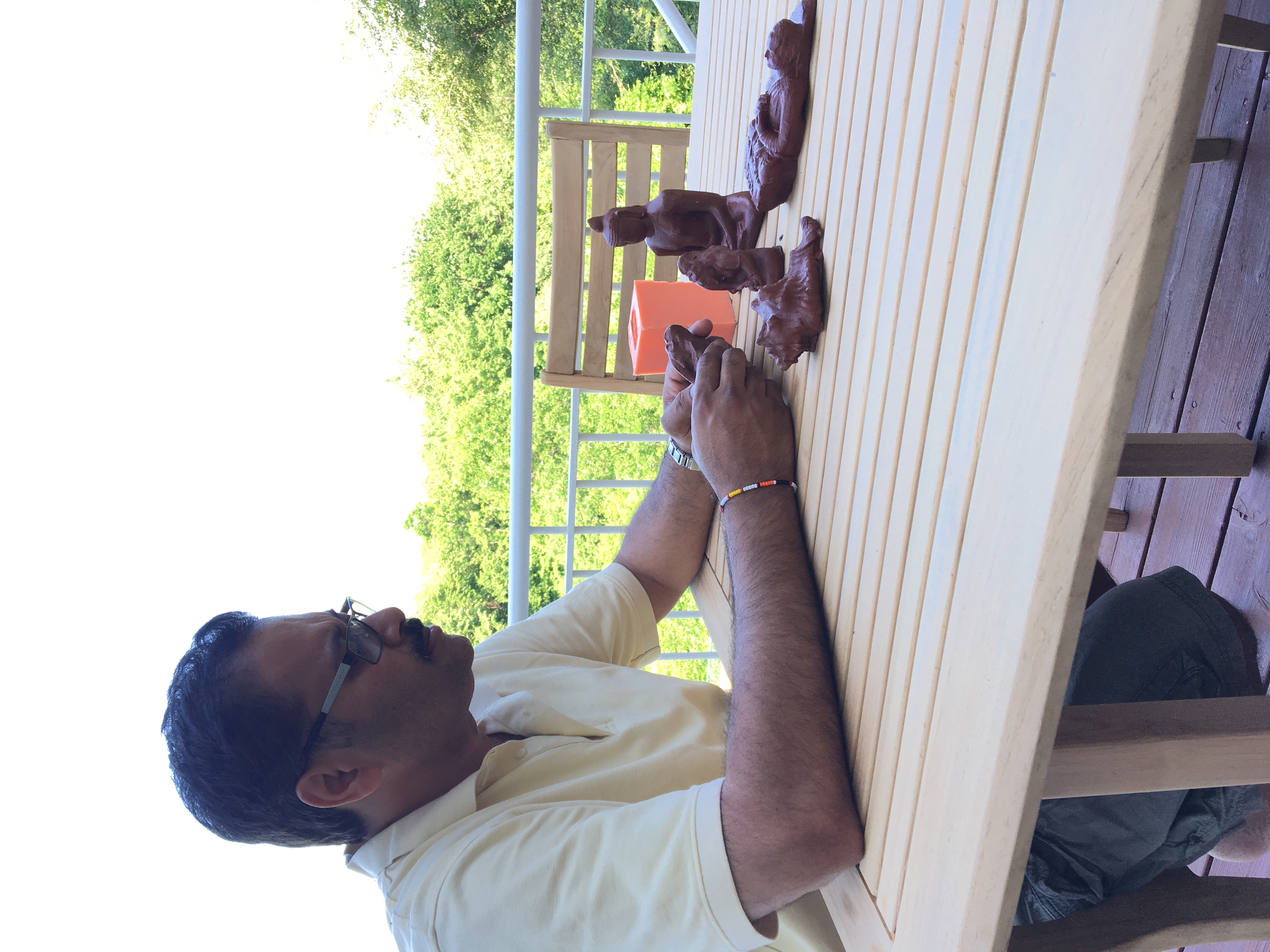 Arun Batchu with concrete casts of 3D printed creations